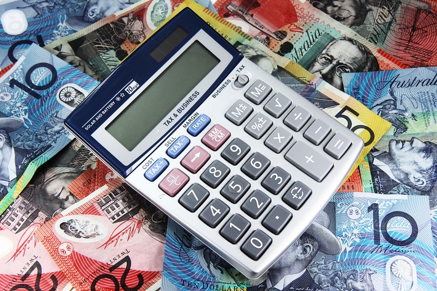 A calculator on a stack of Australian money