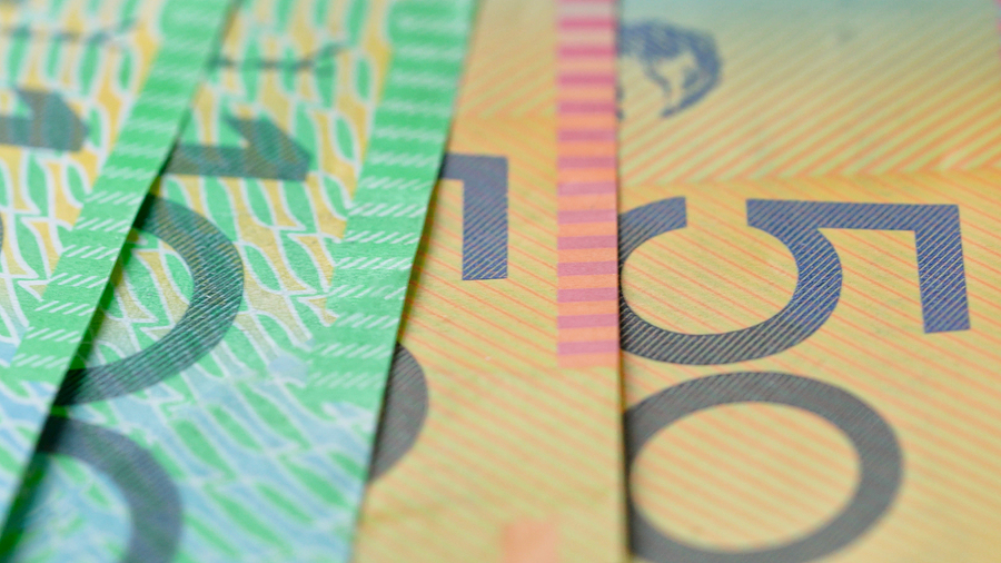 Macro closeup of Australian fifty and one hundred dollar notes, shallow dof.